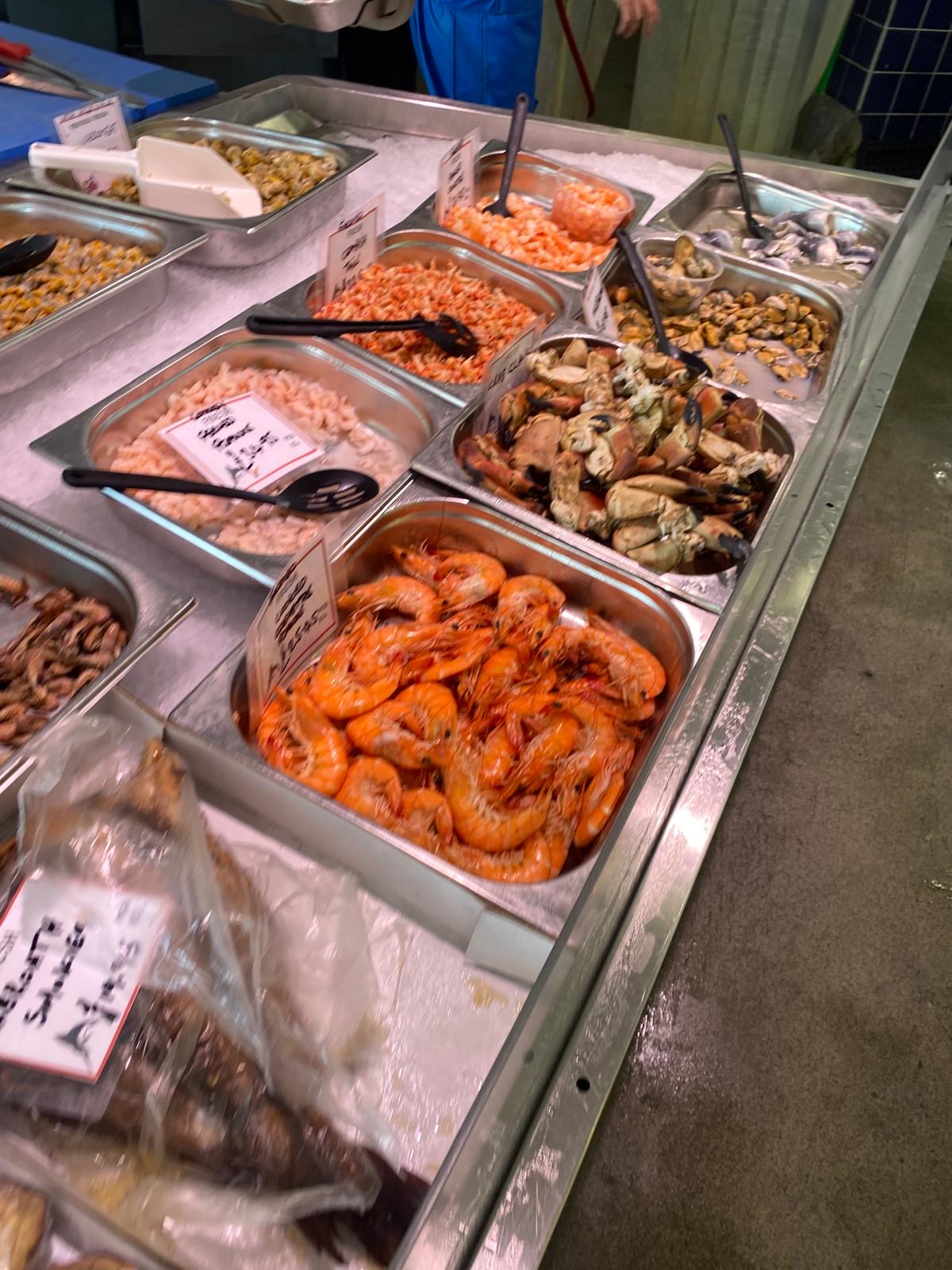 Prawns, crab and seafood displayed at the fish counter