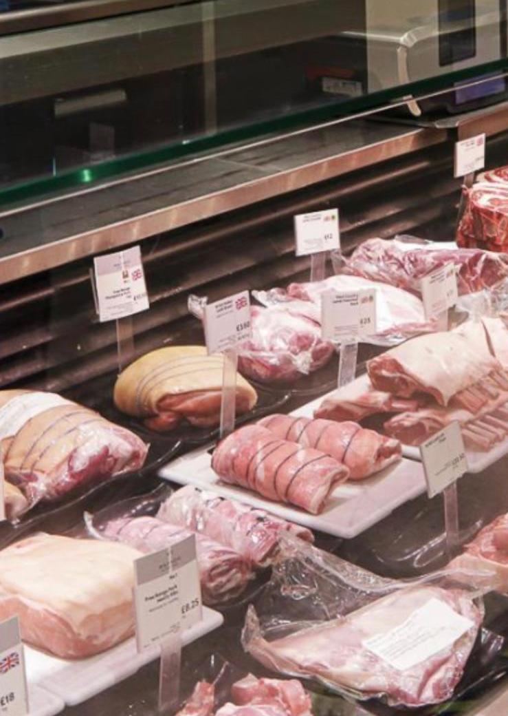 A selection of meat cuts at the butcher counter